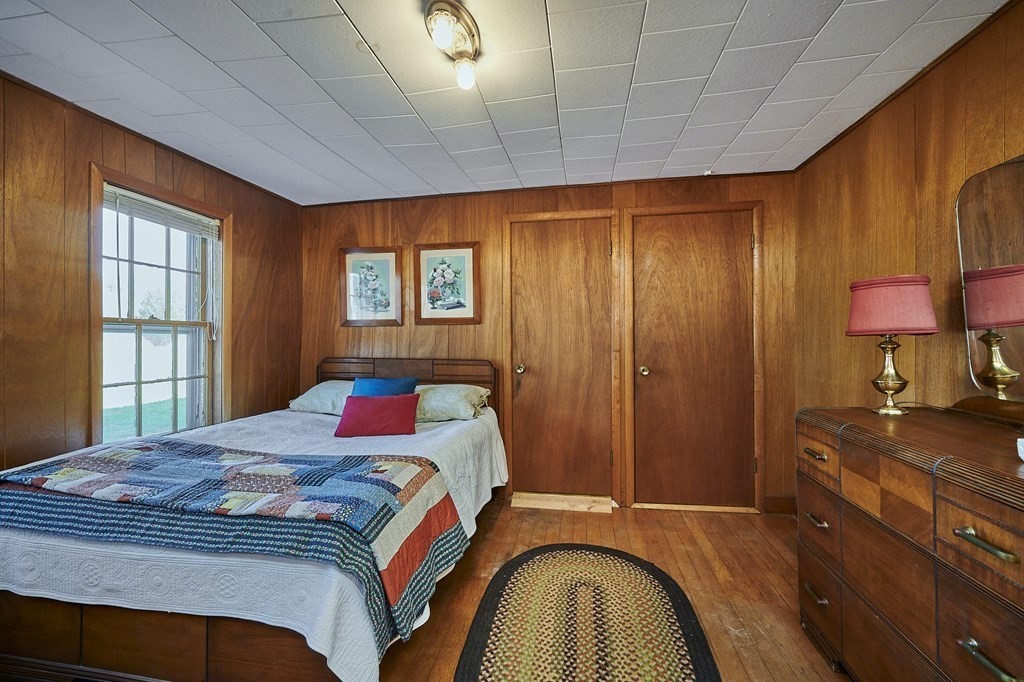 59 Pomeroy Meadow Road Southampton, MA 01073 - Photo 9 of 42 a bedroom with a bed and a lamp