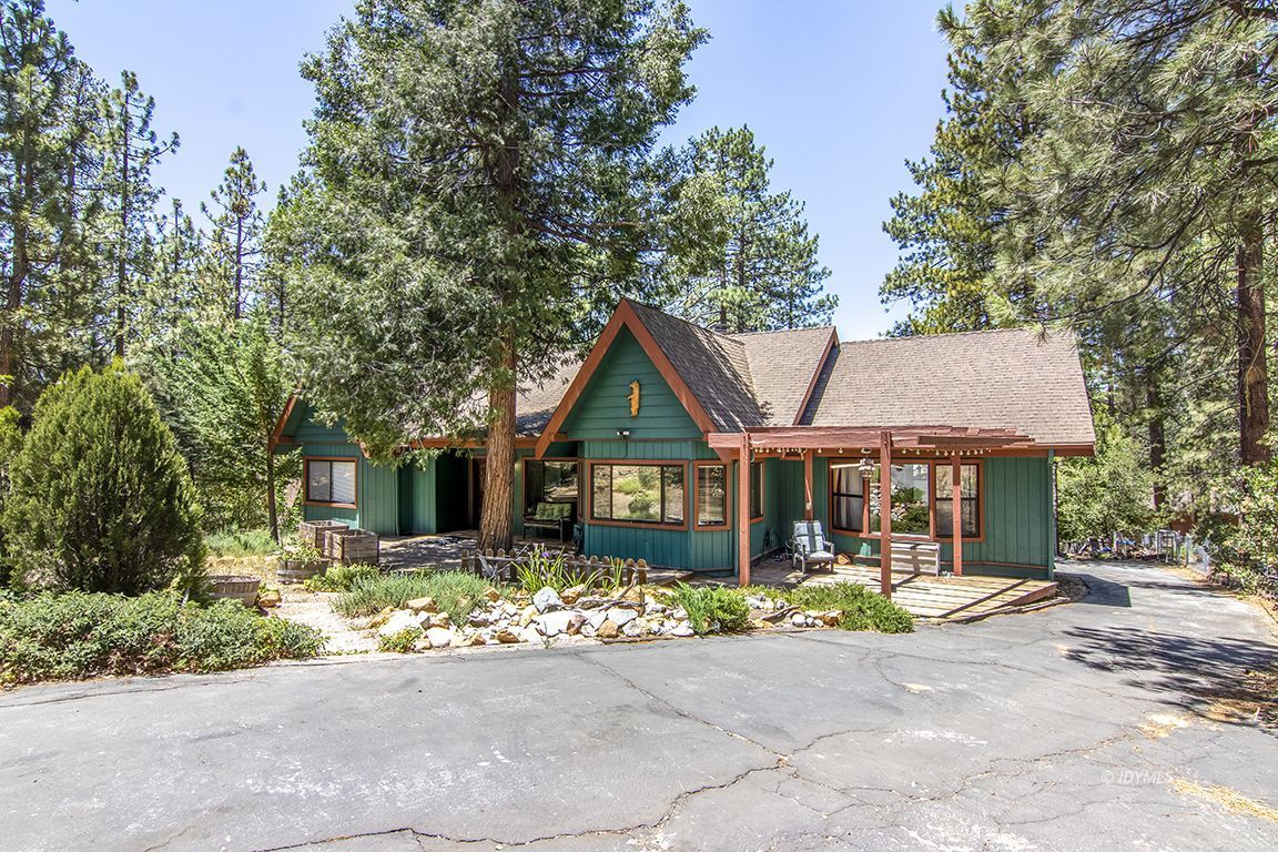 25215 Glen Road Idyllwild, CA 92549 - Photo 3 of 67 a front view of a house with a yard and potted plants