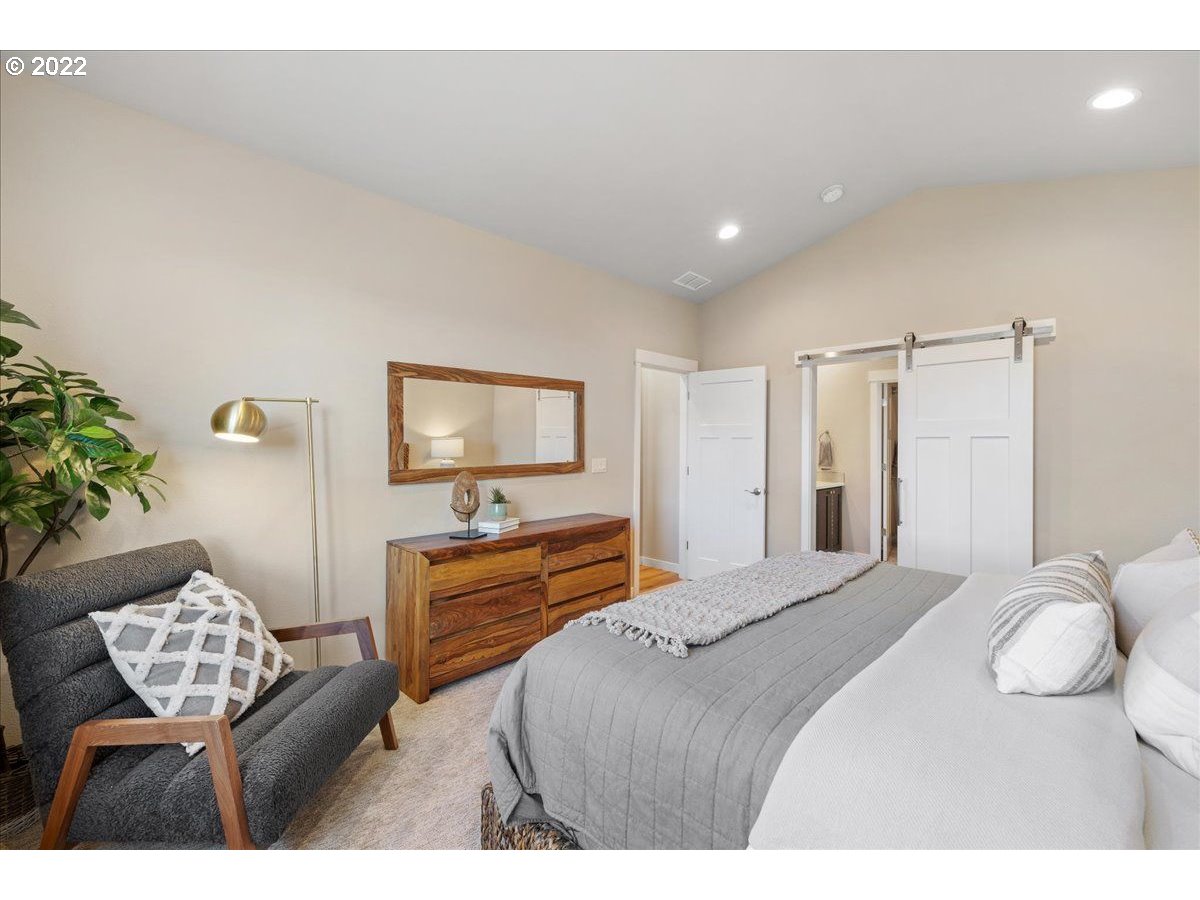 517 North 88th Drive, Unit LT 22 Ridgefield, WA 98642 - Photo 15 of 19 a bedroom with a bed and a couch