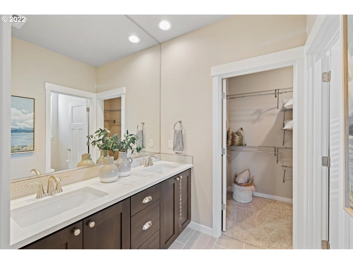 517 North 88th Drive, Unit LT 22 Ridgefield, WA 98642 - Photo 17 of 19 a bathroom with a granite countertop sink mirror and toilet