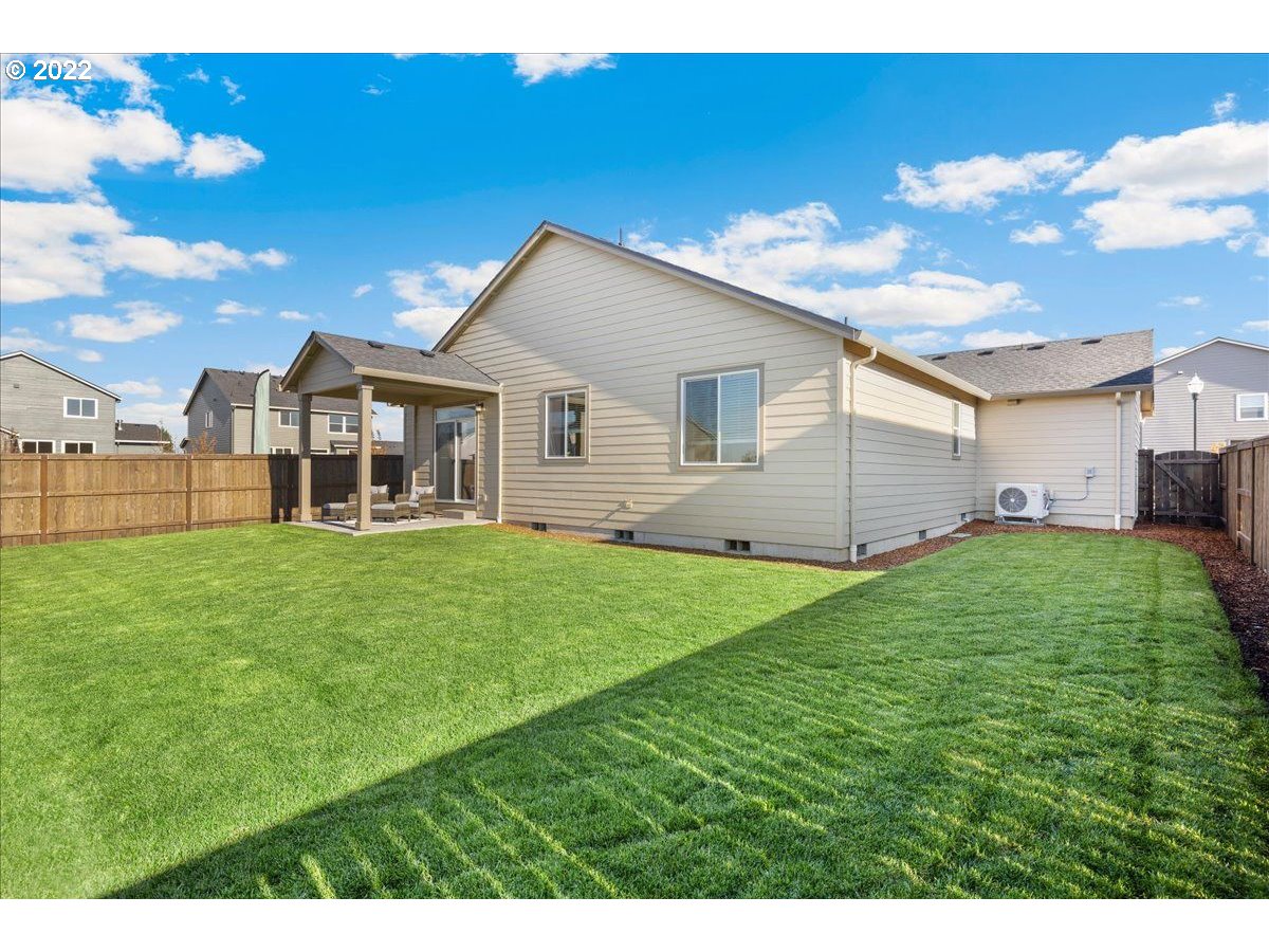 517 North 88th Drive, Unit LT 22 Ridgefield, WA 98642 - Photo 19 of 19 a view of a yard with a house in the background
