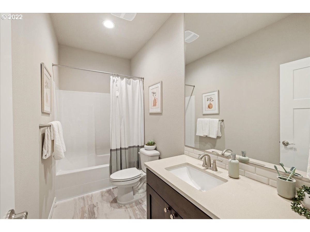 517 North 88th Drive, Unit LT 22 Ridgefield, WA 98642 - Photo 6 of 19 a bathroom with a sink toilet a mirror and shower