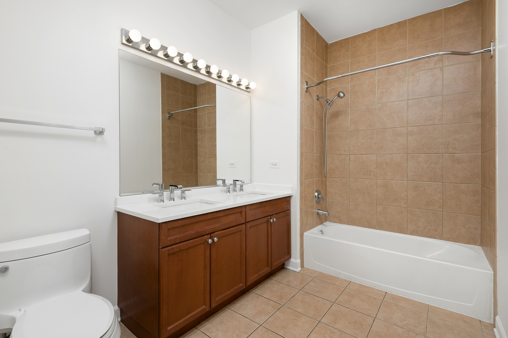 758 West 14th Street, Unit 303 Chicago, IL 60607 - Photo 7 of 9 a bathroom with a sink a toilet and shower