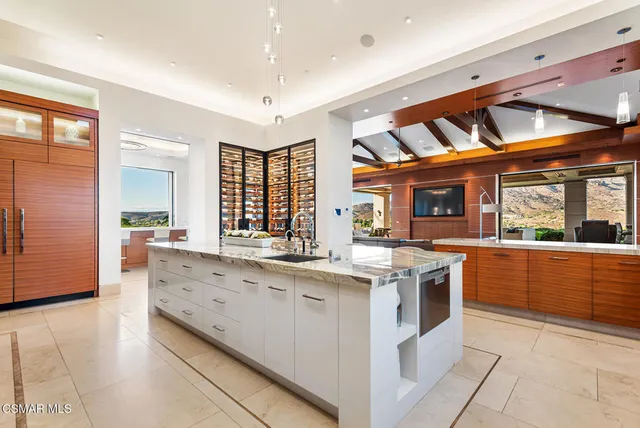 a kitchen with stainless steel appliances granite countertop a stove and cabinets