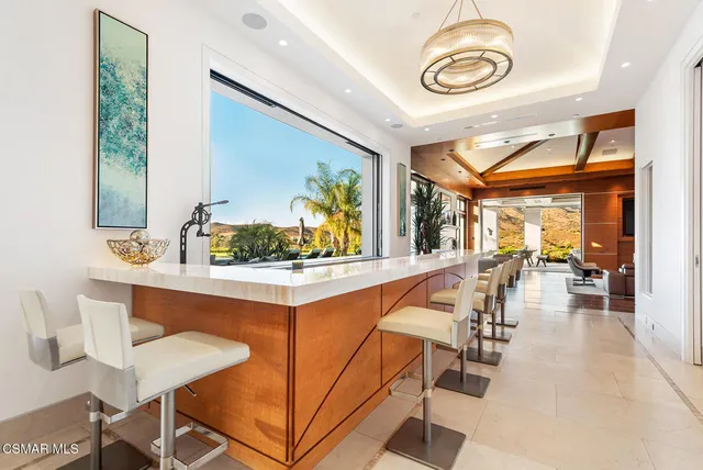 a view of dining room kitchen with furniture and window