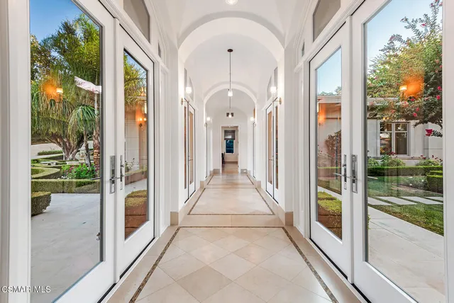 a view of a hallway with a glass door