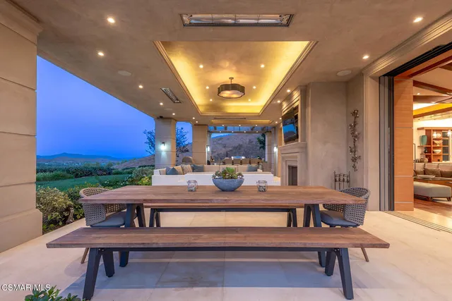 a view of a kitchen with a table and chairs