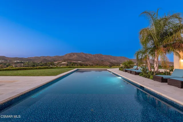 a view of a lake with a house in the background