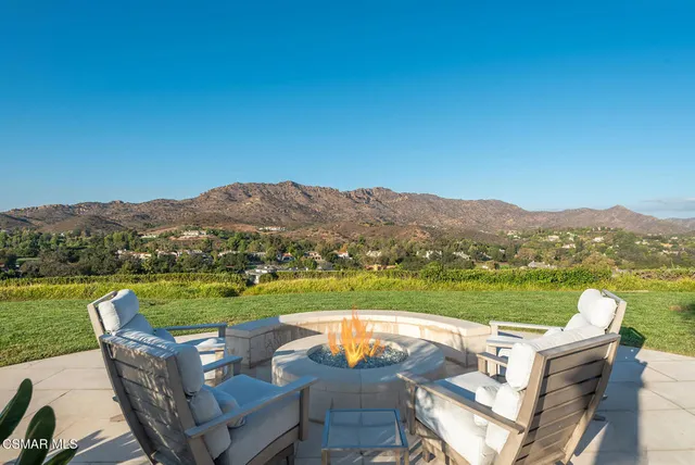 a view of a couches and table in the yard