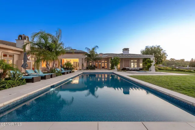 a view of swimming pool from a balcony