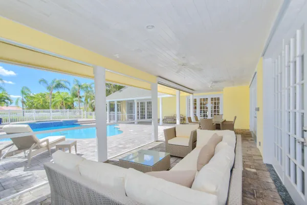a view of a swimming pool with a patio