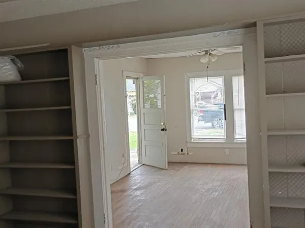 a view of an empty room with a window