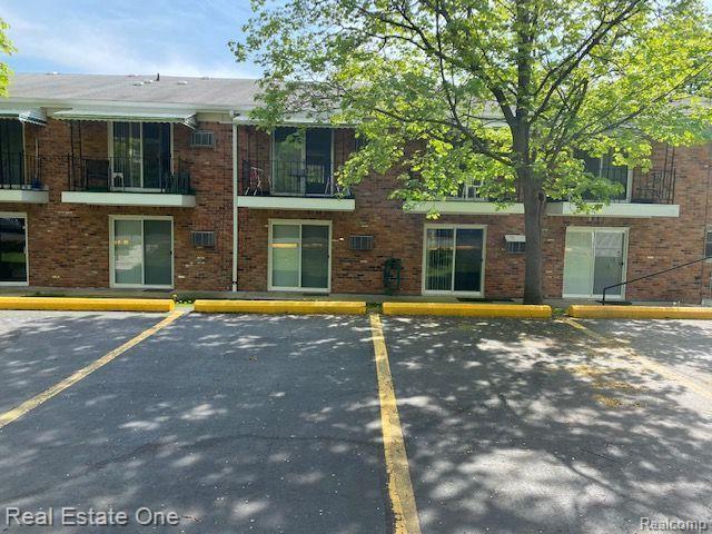 417 Prospect Street, Unit 208 Romeo, MI 48065 - Photo 2 of 16 Parking area in back