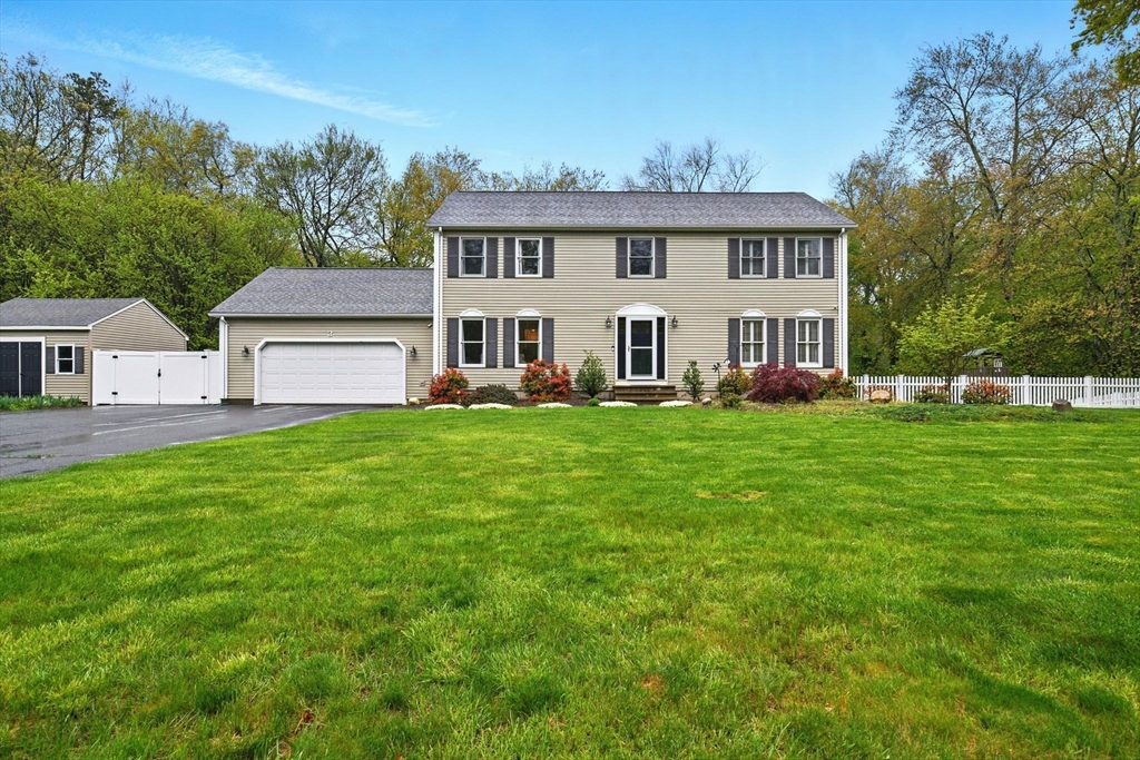 3 Pine Knoll Road Southwick, MA 01077 - Photo 1 of 42 a view of a white house with a big yard and large trees