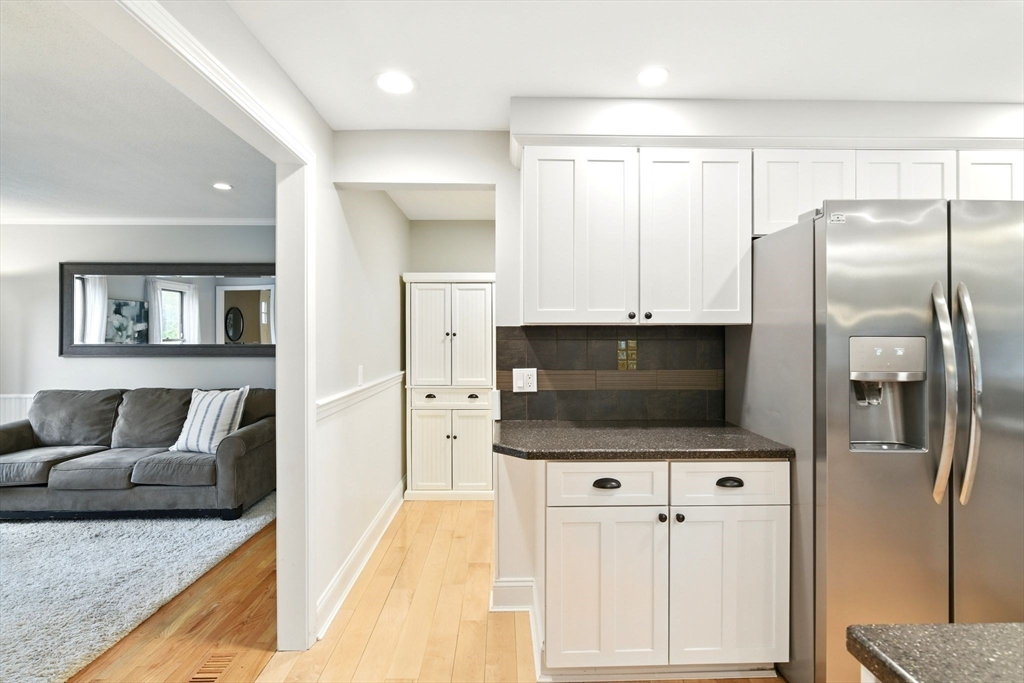 3 Pine Knoll Road Southwick, MA 01077 - Photo 14 of 42 a living room with stainless steel appliances furniture a flat screen tv and a view of kitchen