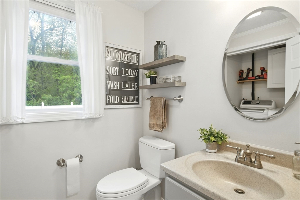 3 Pine Knoll Road Southwick, MA 01077 - Photo 16 of 42 a bathroom with a toilet sink and mirror