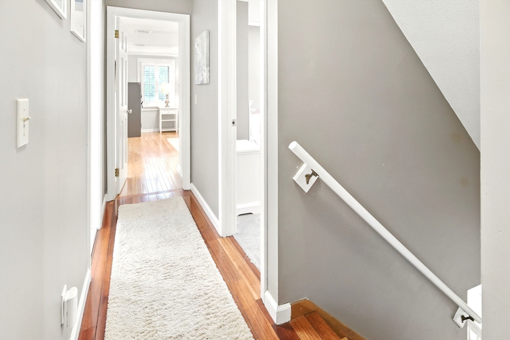 3 Pine Knoll Road Southwick, MA 01077 - Photo 22 of 42 a view of a hallway with wooden floor and staircase