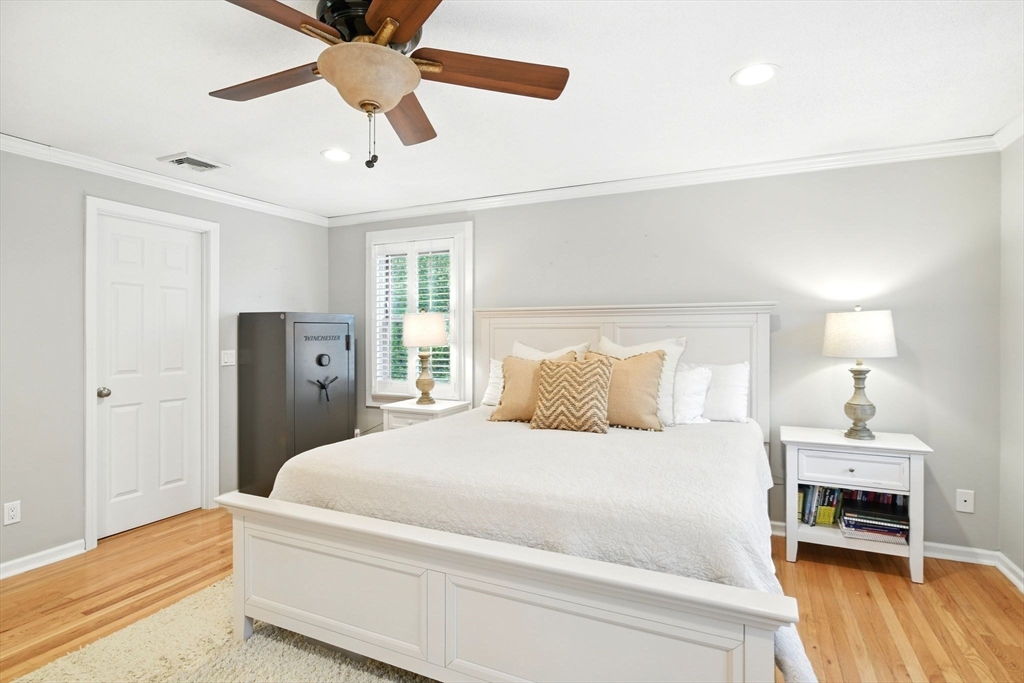 3 Pine Knoll Road Southwick, MA 01077 - Photo 24 of 42 a bedroom with a bed and a chandelier
