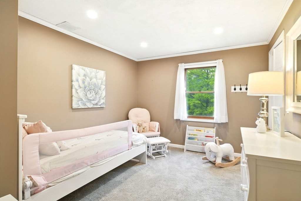 3 Pine Knoll Road Southwick, MA 01077 - Photo 29 of 42 a bedroom with a bed and window