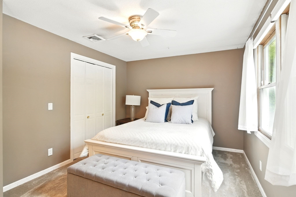 3 Pine Knoll Road Southwick, MA 01077 - Photo 35 of 42 a bedroom with a bed and a window