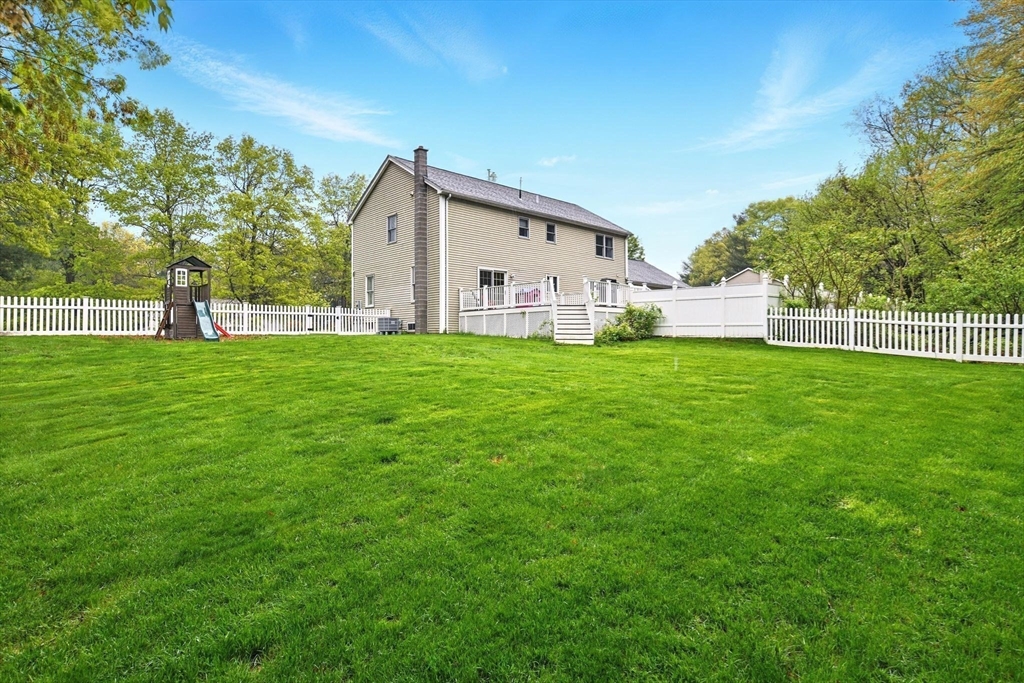 3 Pine Knoll Road Southwick, MA 01077 - Photo 41 of 42 a view of a house with a yard and deck