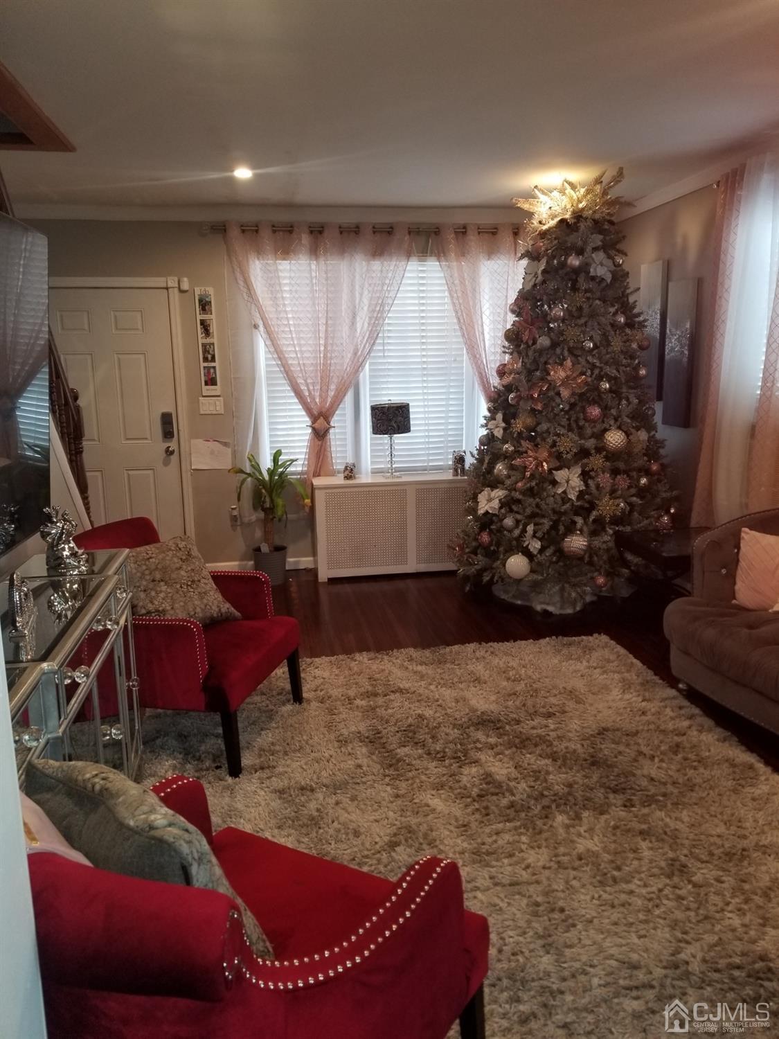 118 Rector Street Perth Amboy, NJ 08861 - Photo 3 of 12 a bed room with a bed and a couch