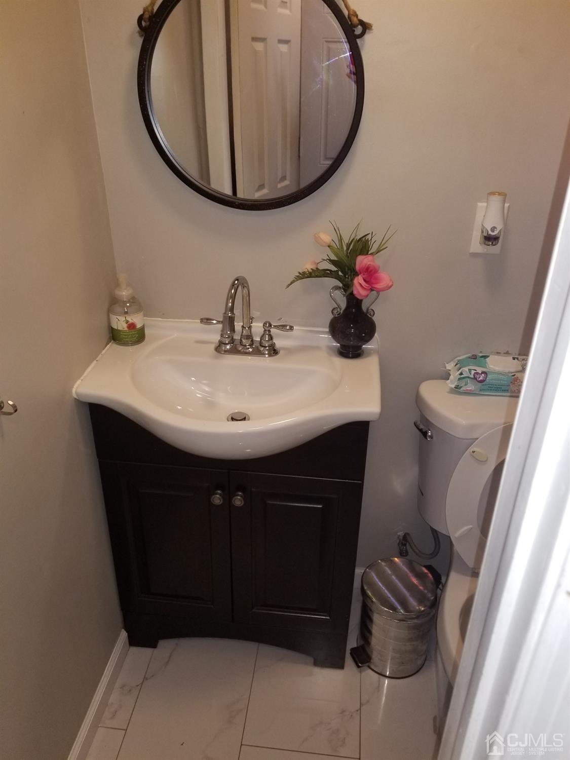 118 Rector Street Perth Amboy, NJ 08861 - Photo 7 of 12 a bathroom with a sink and a mirror