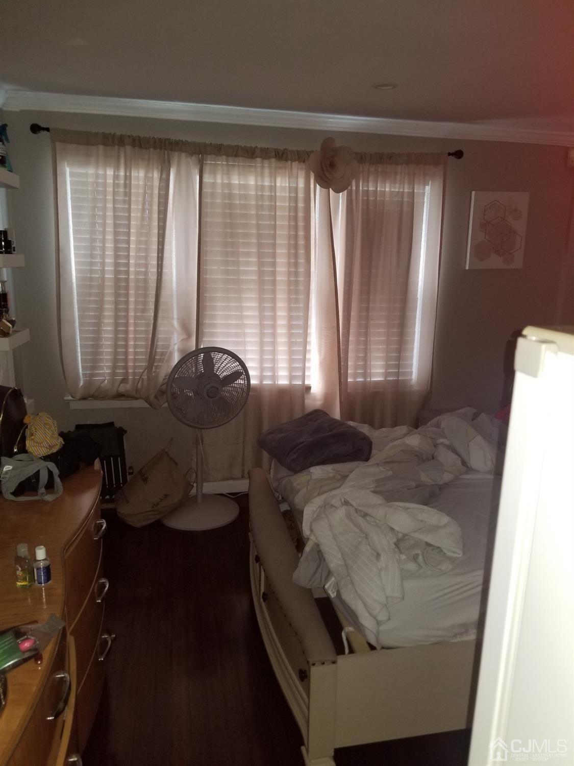 118 Rector Street Perth Amboy, NJ 08861 - Photo 8 of 12 a room with furniture and large windows