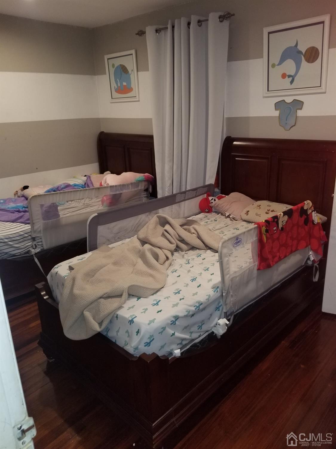 118 Rector Street Perth Amboy, NJ 08861 - Photo 10 of 12 a bedroom with a bed and dresser