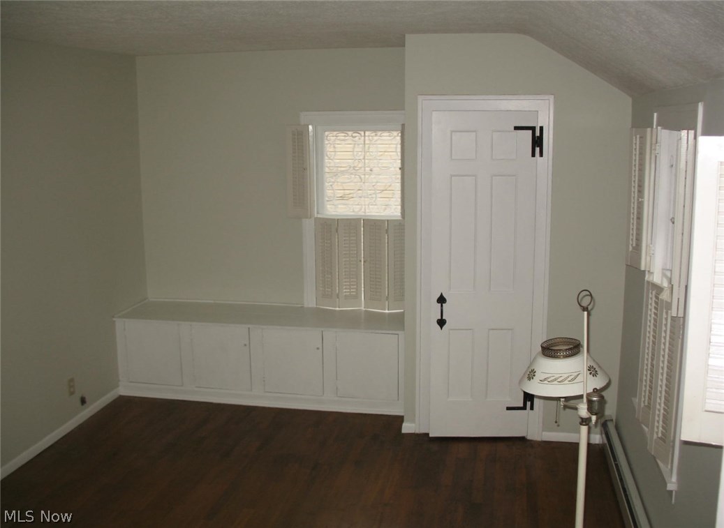 Master bedroom closet and window seat with additional storage.