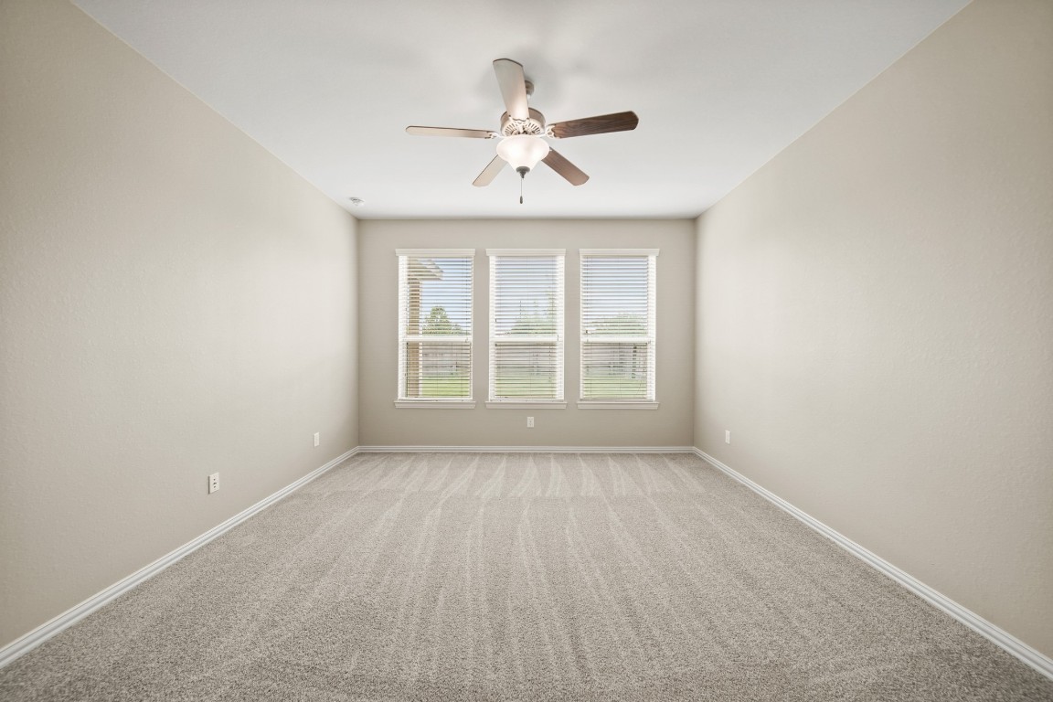 13230 Dover Bluff Drive Rosharon, TX 77583 - Photo 18 of 33 Wall of windows overlooking the backyard