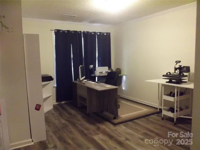 a kitchen with a refrigerator and a stove top oven