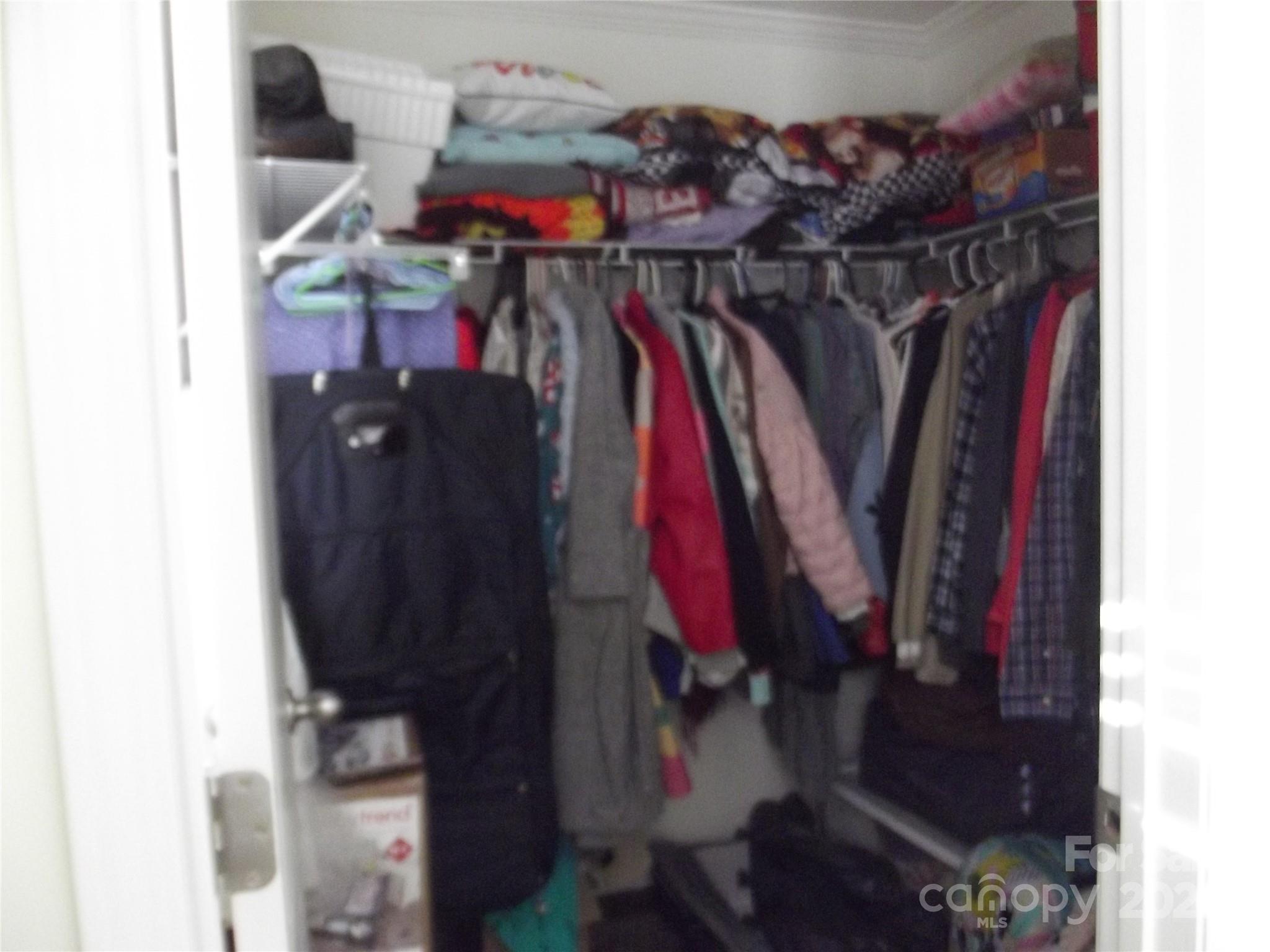 1502 Mulberry Ridge Drive, Unit 1 Newton, NC 28658 - Photo 32 of 39 a view of walk in closet with clothes and shoes
