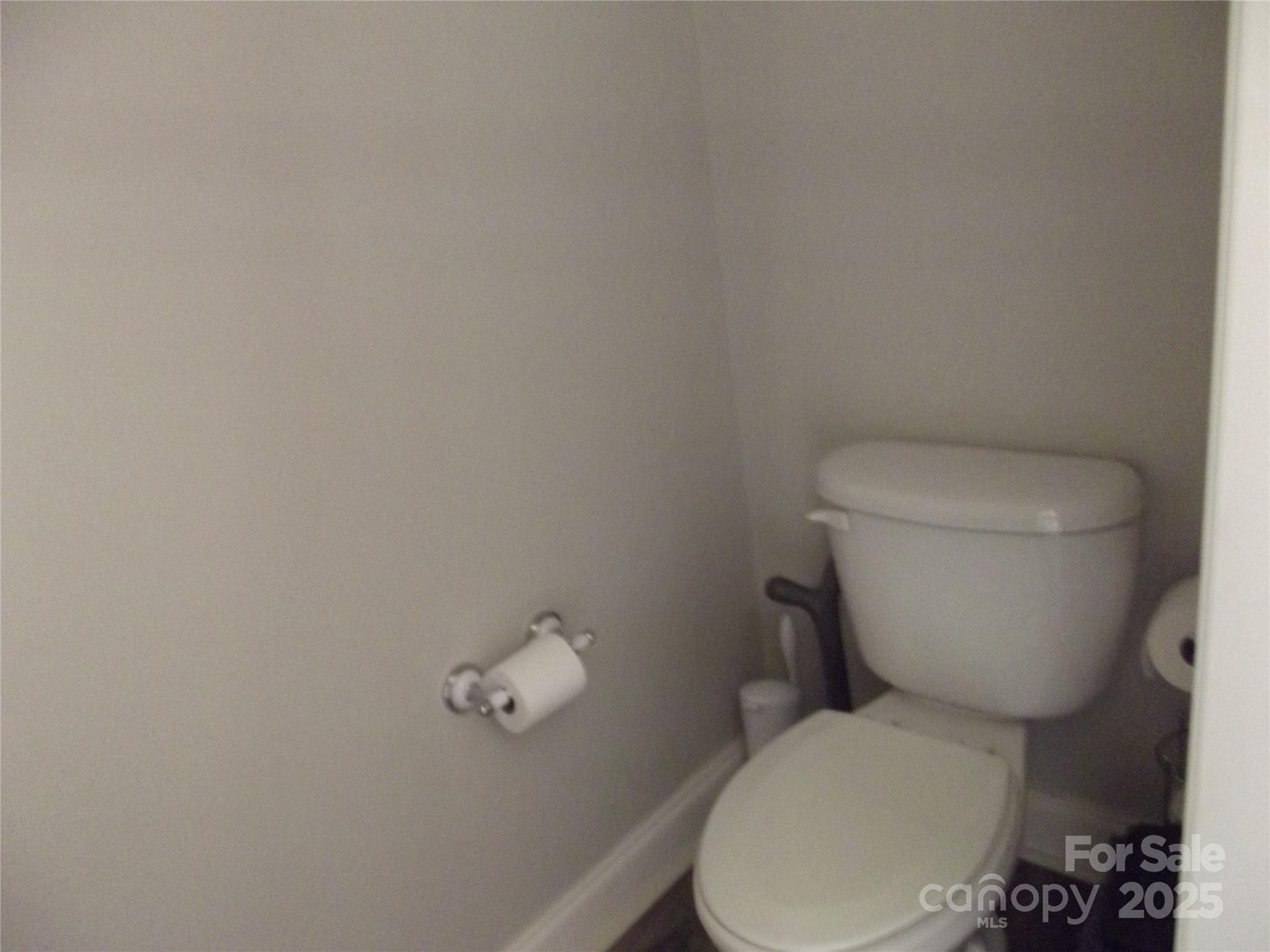 1502 Mulberry Ridge Drive, Unit 1 Newton, NC 28658 - Photo 9 of 39 a white toilet sitting next to a white wall