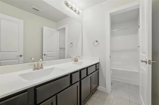 an empty room with windows and stairs