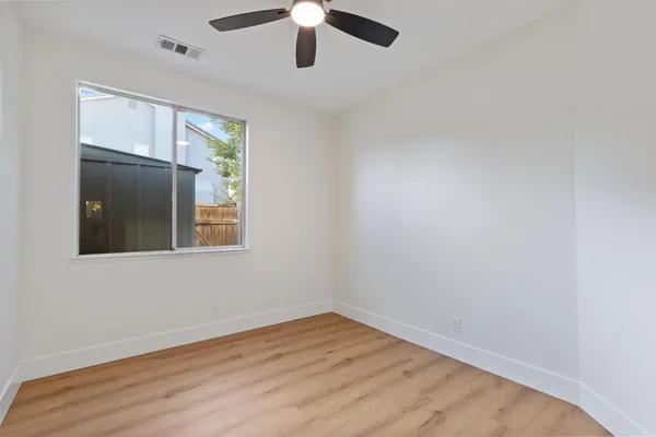a view of room with hardwood floor