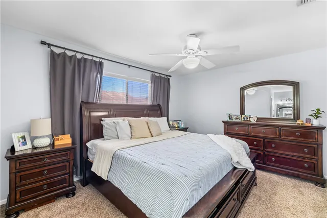 a bedroom with a bed and a dresser