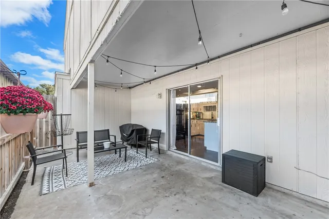 a dining room with furniture and flowers