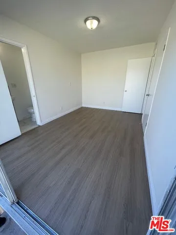 an empty room with wooden floor