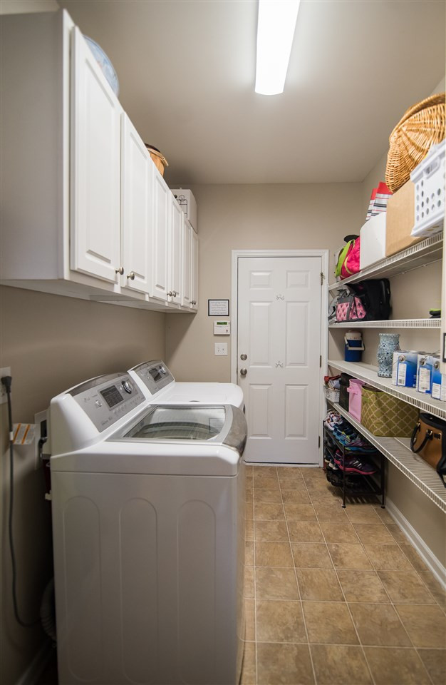 2307 Bright Future Way Raleigh, NC 27614 - Photo 11 of 23 Large laundry room with plenty of extra storage! Laundry Room