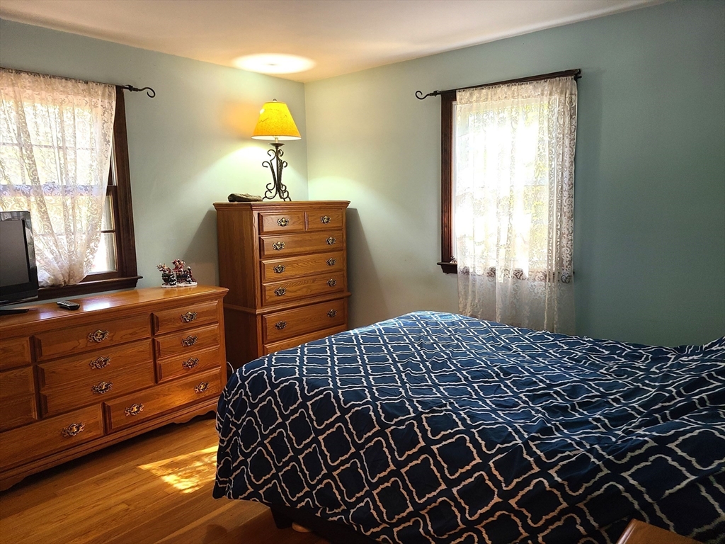 131 Holly Ridge Drive Hanson, MA 02341 - Photo 13 of 36 a bedroom with a bed and window