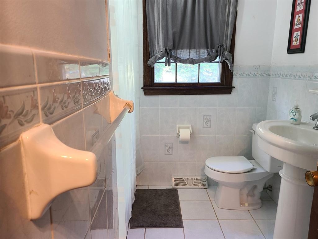 131 Holly Ridge Drive Hanson, MA 02341 - Photo 18 of 36 a bathroom with a toilet and a sink