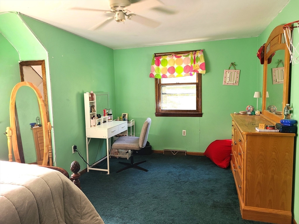 131 Holly Ridge Drive Hanson, MA 02341 - Photo 21 of 36 a bedroom with a bed and windows