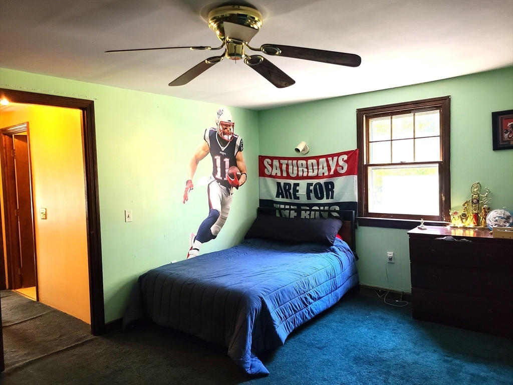 131 Holly Ridge Drive Hanson, MA 02341 - Photo 23 of 36 a bedroom with a bed and a window