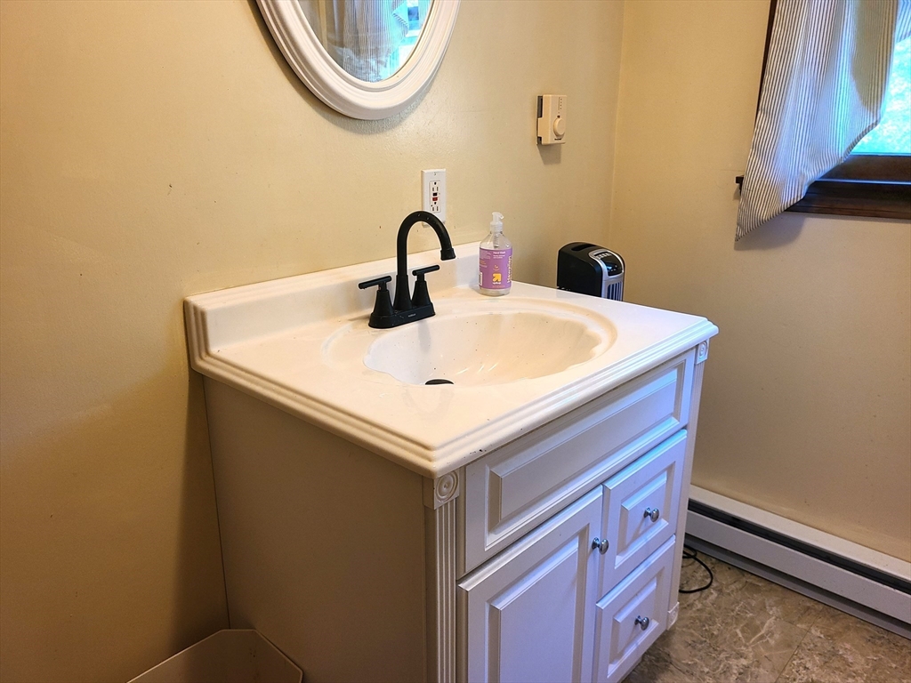 131 Holly Ridge Drive Hanson, MA 02341 - Photo 26 of 36 a bathroom with a sink and a vanity