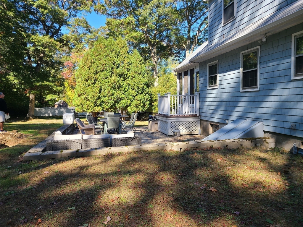 131 Holly Ridge Drive Hanson, MA 02341 - Photo 29 of 36 a view of a house with backyard and sitting area