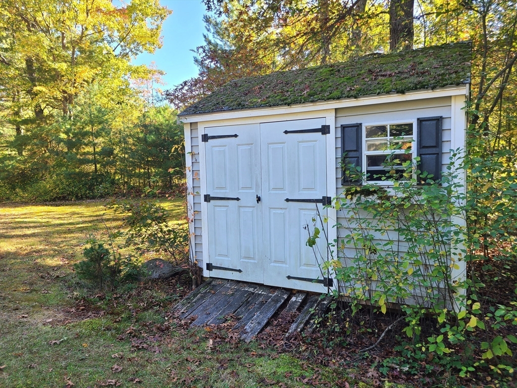 131 Holly Ridge Drive Hanson, MA 02341 - Photo 32 of 36 a view of a house with a yard