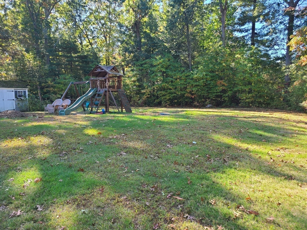 131 Holly Ridge Drive Hanson, MA 02341 - Photo 33 of 36 a view of a backyard with swimming pool