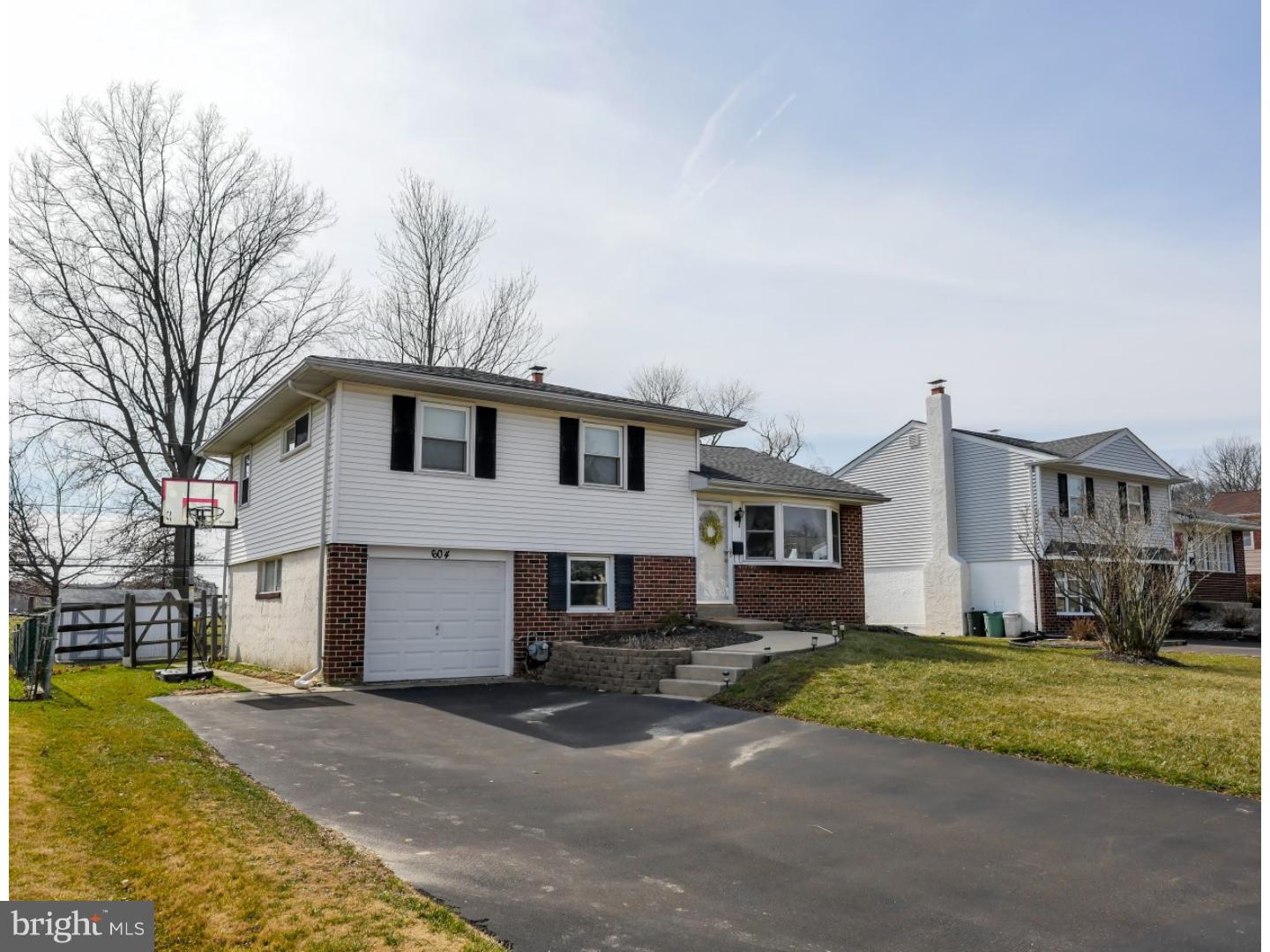 604 Exton Road Hatboro, PA 19040 - Photo 2 of 21 a front view of a house with a yard and garage