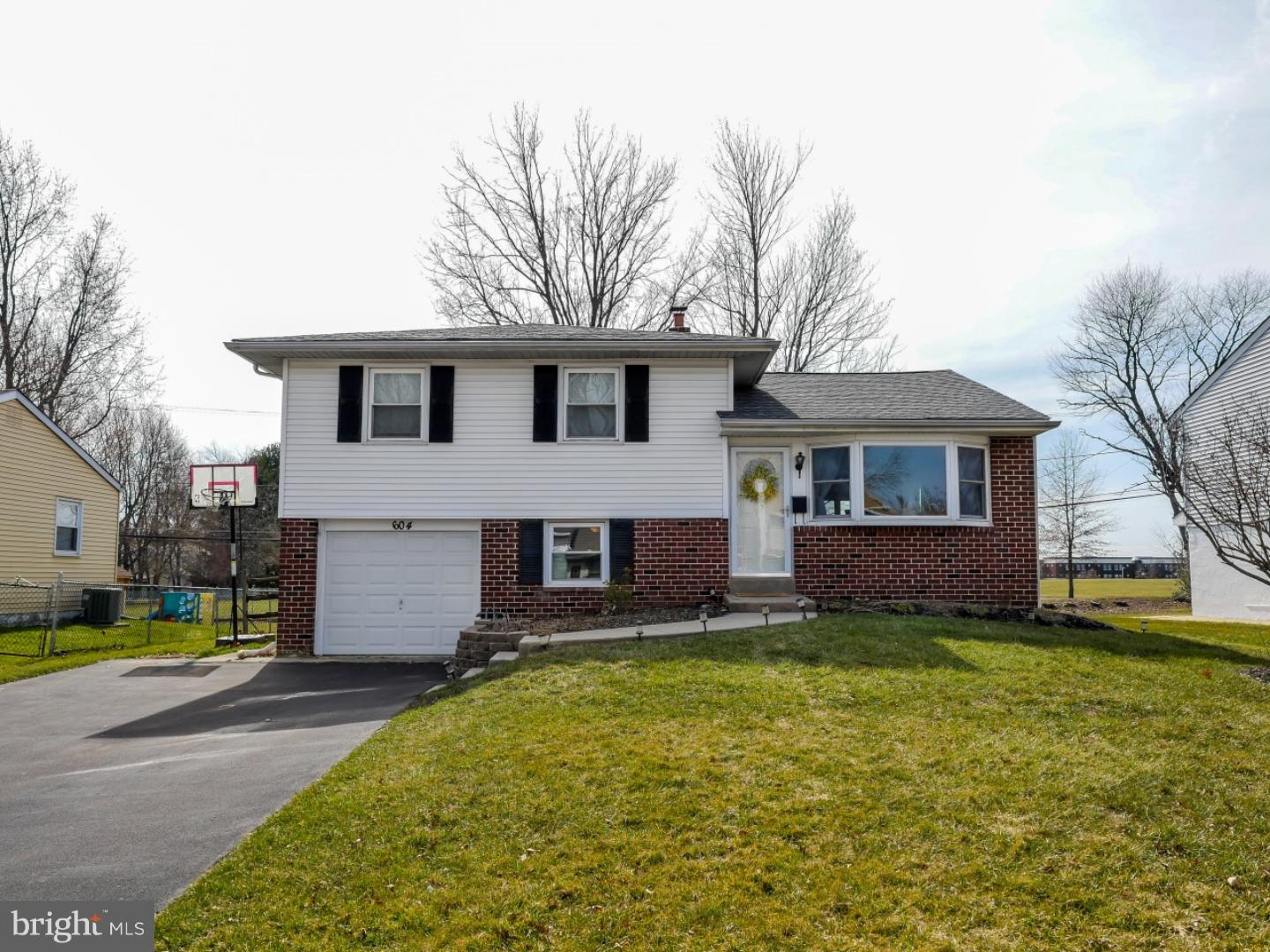 604 Exton Road Hatboro, PA 19040 - Photo 21 of 21 a front view of house with yard and trees in the background